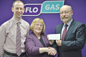 Anthony Mulligan (on right) & Paul Ruegg (on left) of  Flogas presenting a £500 cheque to Kay Taylor, Chairperson of the Belfast Samaritans, at the Flogas customer support office in Belfast on Monday 25th November 2013.