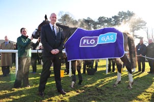 ohn Rooney, managing director of Flogas Ireland is pictured with Apache Stronghold, the winner of the inaugural Flogas Novice Chase and Emma Connolly, his groom.