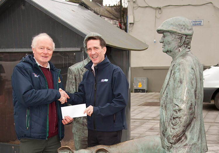 Jarlath Fahey, a member of the St Vincent de Paul Ballyhaunis Conference, is presented with a €500 cheque by Roy Masterson,sales representative, Flogas Ireland.