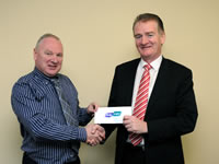 Michael Gilmartin of Flogas Ireland (on right) presenting a €500 cheque to Dr John Griffin, president of the SVP Ballyhaunis Conference, on Monday 26 November in Ballyhaunis. 