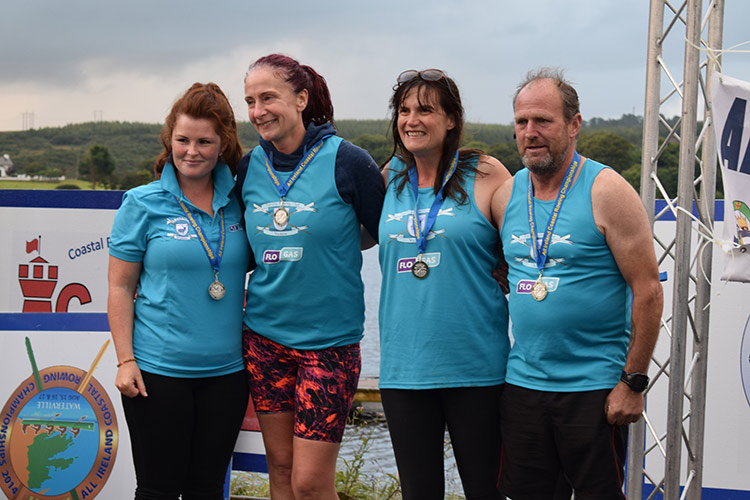 l/r Samantha Doyle, Liz O’Toole, Nicola Fitzgerald with their coxswain George O’Brien, silver medal winners in the Ladies Celtic Longboat race at the 2017 Coastal Rowing Championships. Missing from pic is fellow crew member, Sarah Byrne.