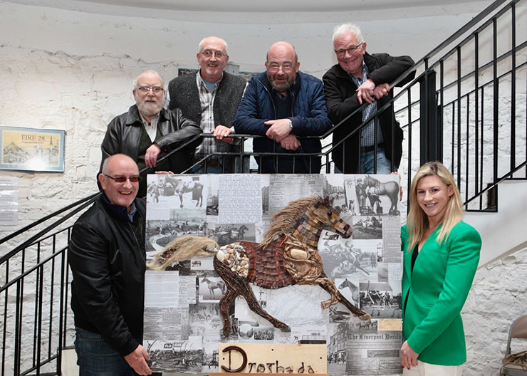 Image showing the Ardara Mens Shed group with their award winning 'Reimagine Drogheda' art piece, with Flogas team member